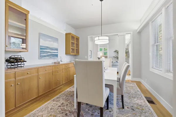 a view of a dining room with furniture window and wooden floor