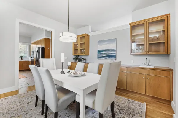 a view of a dining room with furniture window and wooden floor
