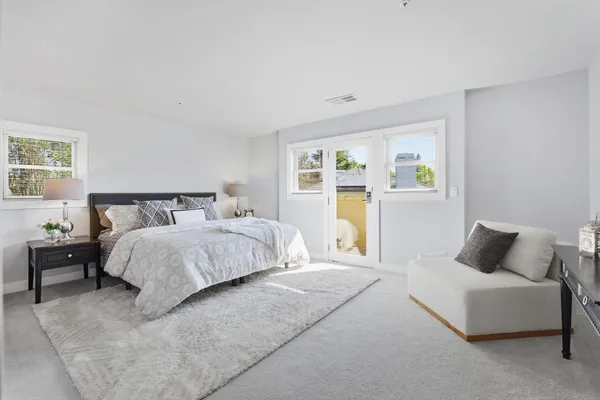 a bedroom with bed and window