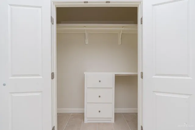 a view of an empty walk in closet