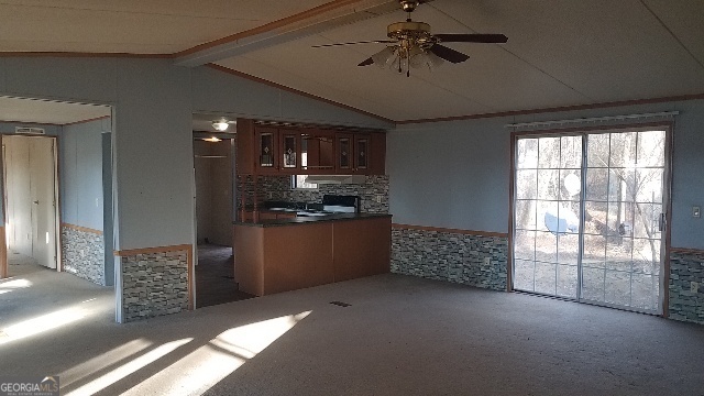 2331 Kesler Road Carnesville, GA 30521 - Photo 24 of 50 a kitchen with stainless steel appliances kitchen island granite countertop a refrigerator and a stove top oven