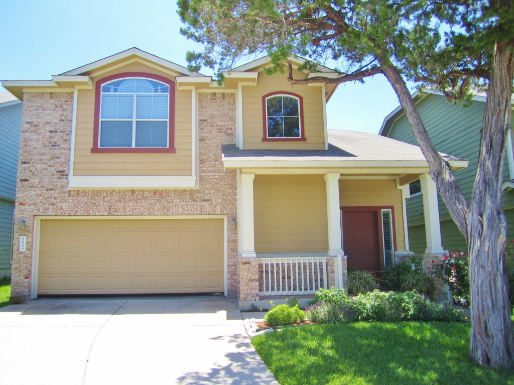 8606 Winterstein Drive Austin, TX 78745 - Photo 1 of 1 a front view of a house with garden