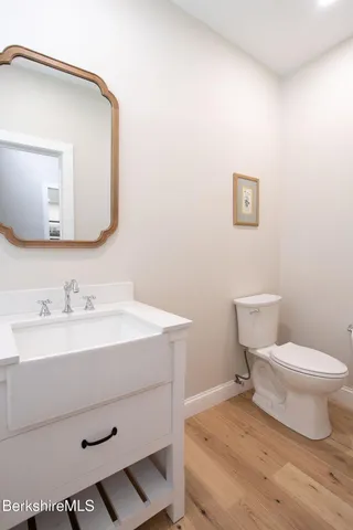 a view of a hallway view with wooden floor and staircase