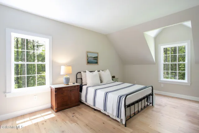 a bedroom with a bed and a table in it