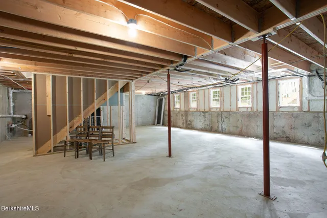 a view of a chair and tables on the roof deck
