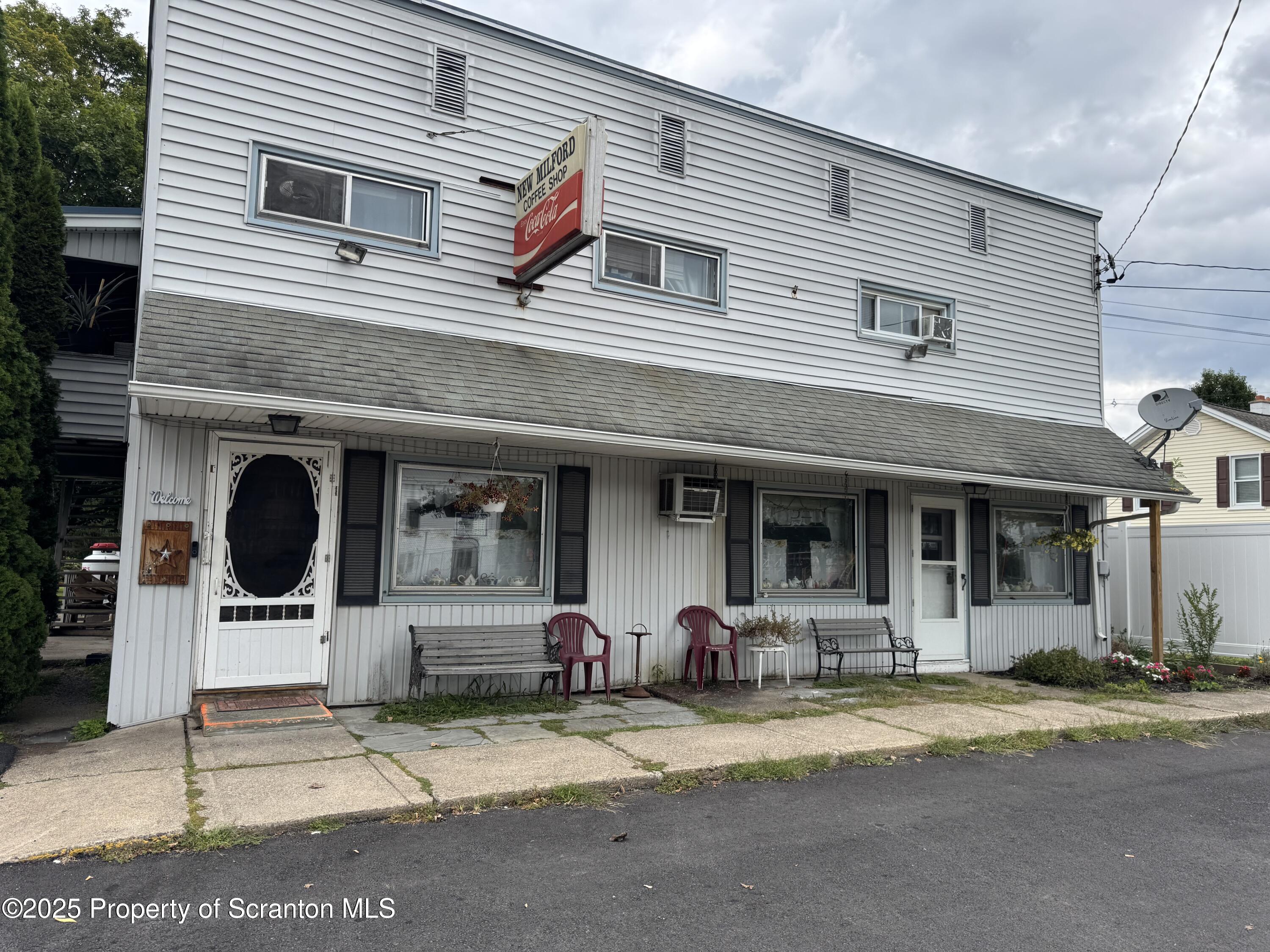 a front view of a house with a patio