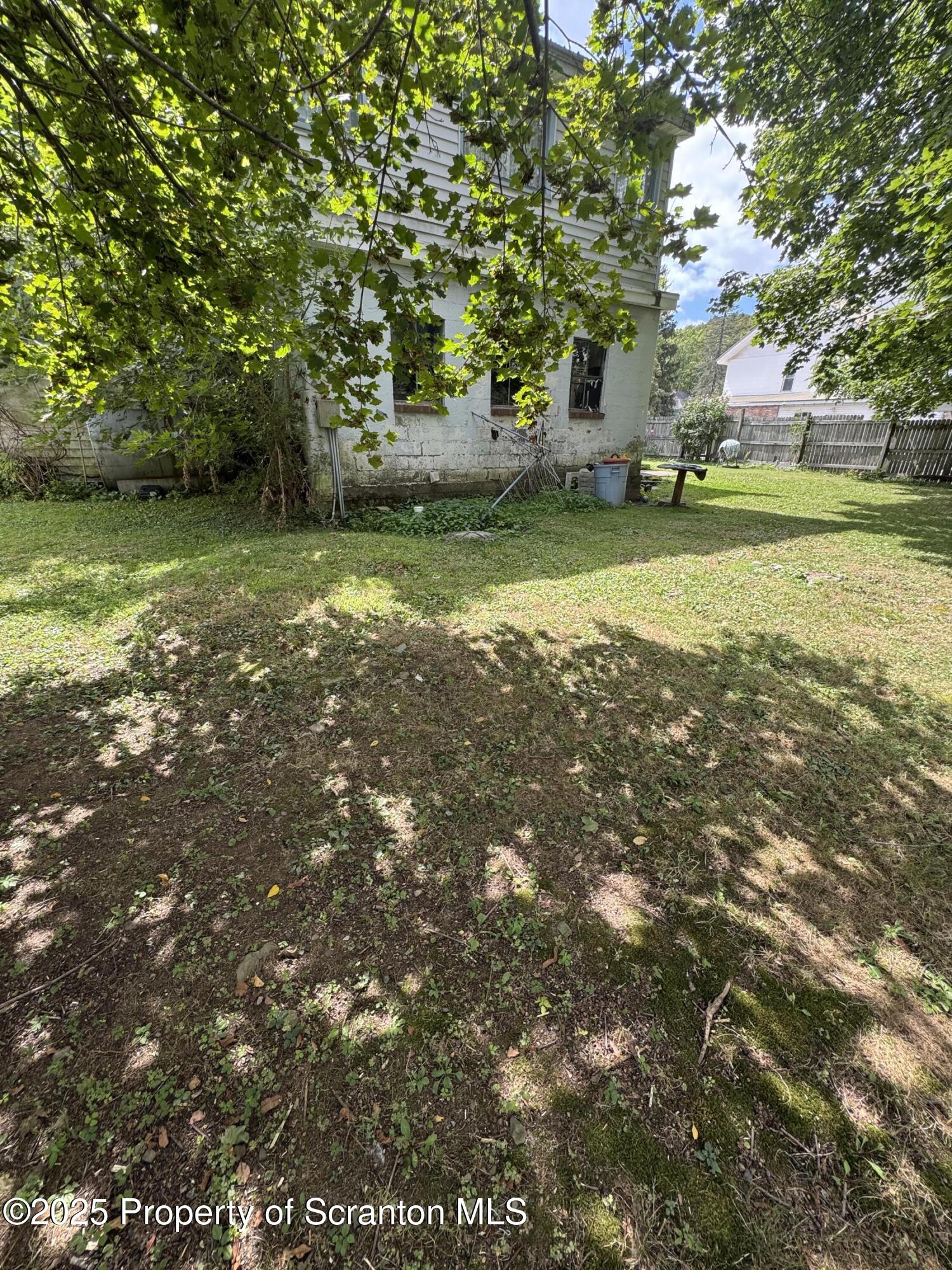 47 Broad Street New Milford, PA 18834 - Photo 22 of 65 a view of a yard with a tree