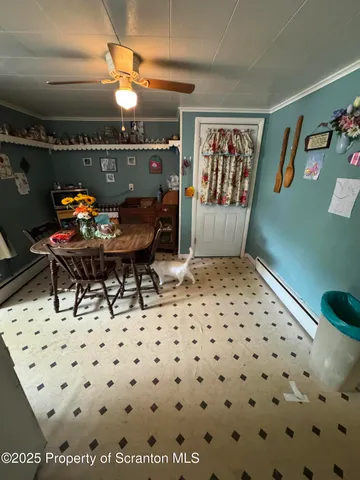 a living room with furniture gym equipment and a large window
