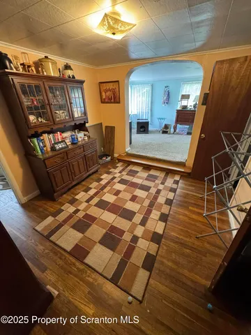 a living room with furniture window and a flat screen tv