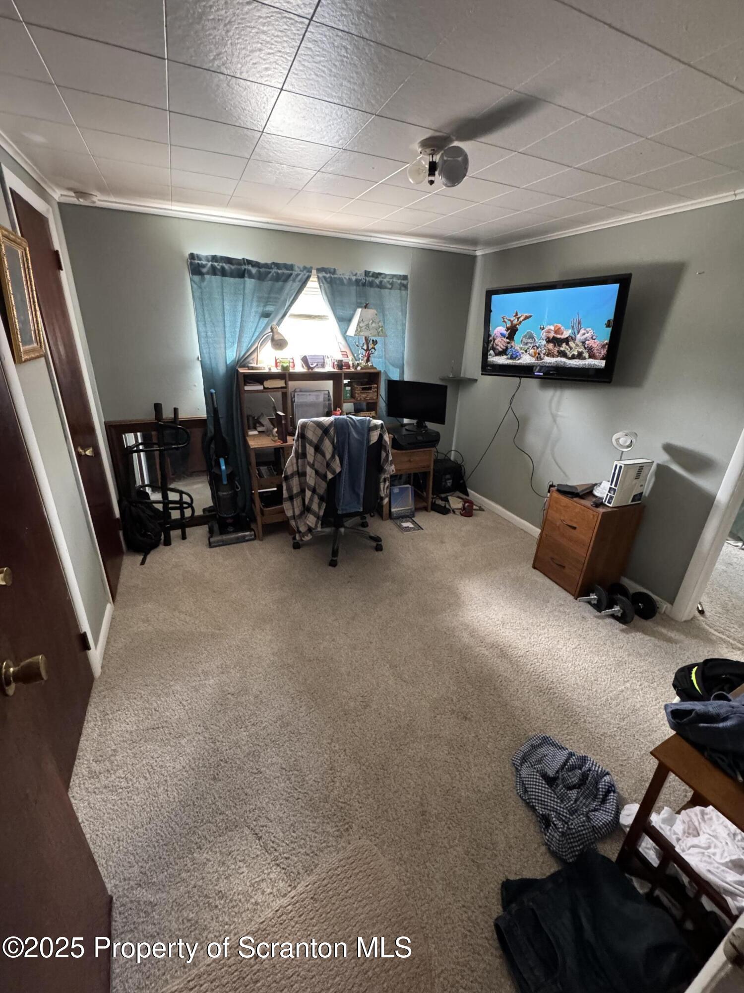 47 Broad Street New Milford, PA 18834 - Photo 60 of 65 a living room with furniture and a flat screen tv