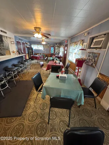 a view of a dining room with furniture