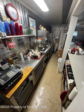 a room with lots of furniture and clutter