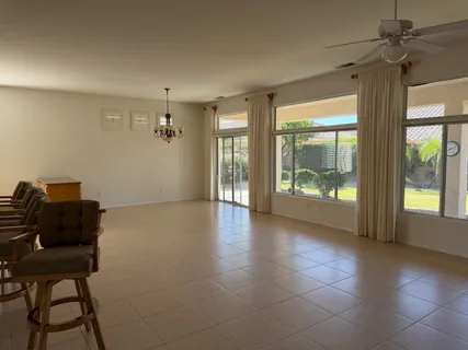 a view of workspace with furniture and windows