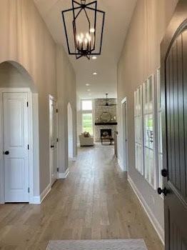 T3 15929 Prairie View Lockport, IL 60441 - Photo 2 of 27 an empty room with wooden floor mirror and windows