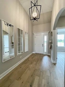 T3 15929 Prairie View Lockport, IL 60441 - Photo 3 of 27 a view of empty room with wooden floor and door