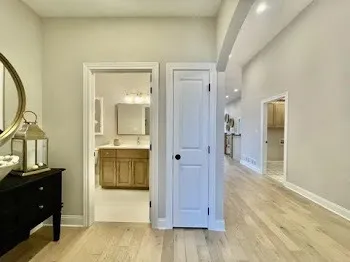 a bathroom with a double vanity sink mirror and toilet