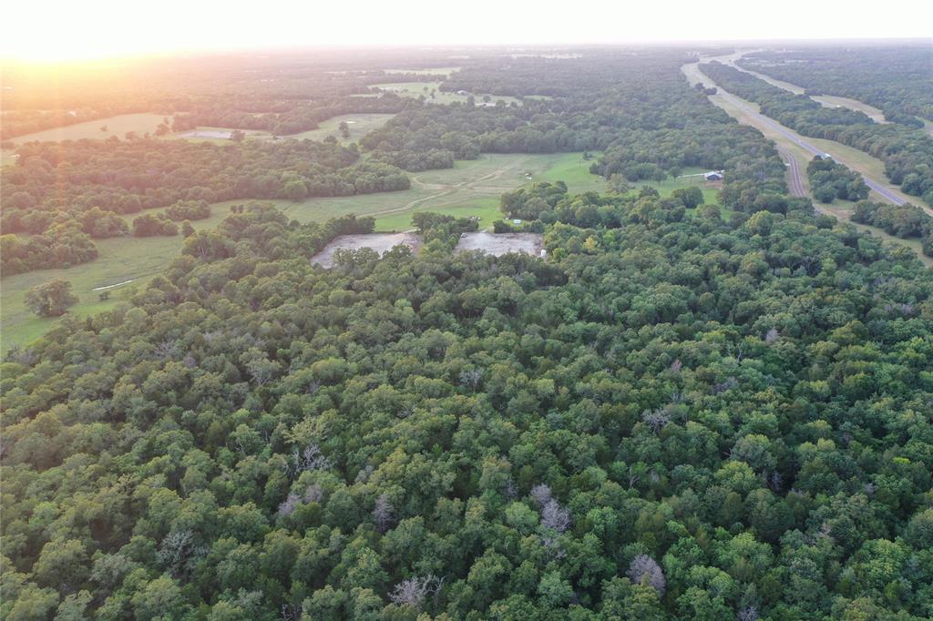 720 Interstate 45 Teague, TX 75860 - Photo 10 of 10 an aerial view of houses with yard and mountain view in back