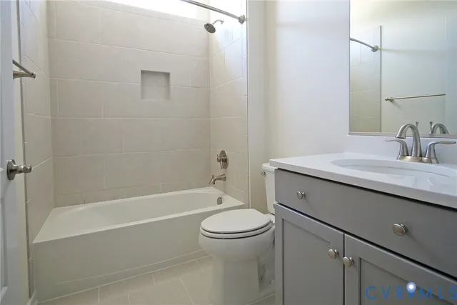a bathroom with a sink a toilet and a bathtub
