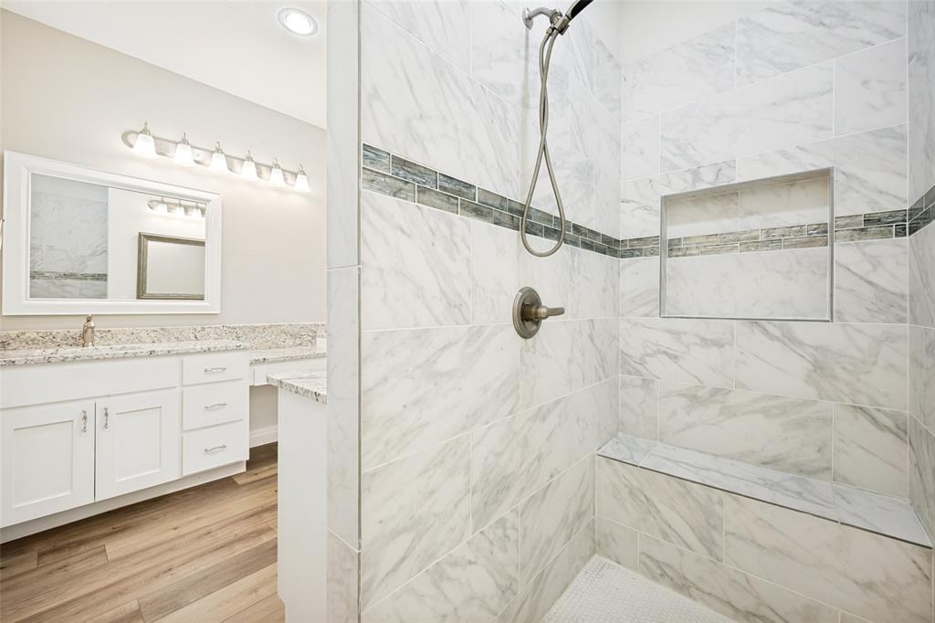 444 Ben Boyd Road Argyle, TX 76226 - Photo 20 of 28 a bathroom with a granite countertop shower sink and mirror