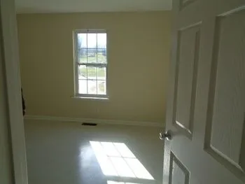 a view of an empty room and window