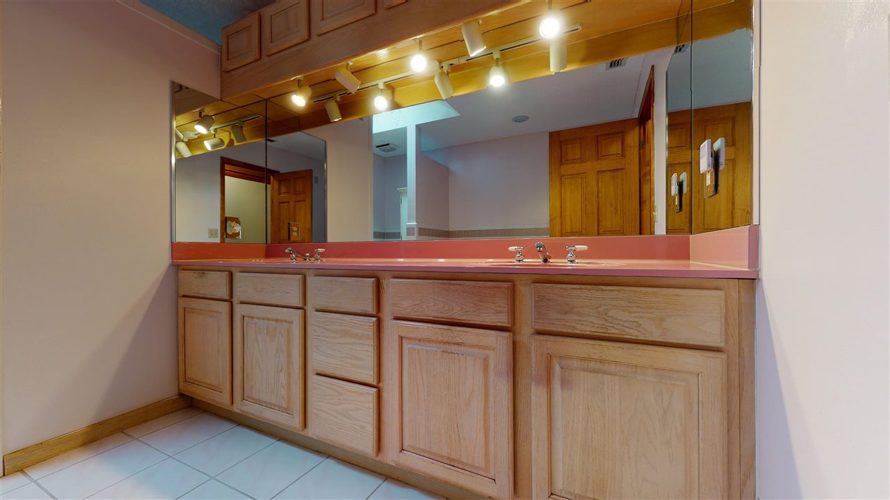 60 Palmer Street St. Augustine, FL 32084 - Photo 12 of 26 a bathroom with a sink and a mirror