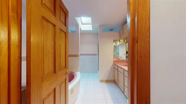 a bathroom with a sink and mirror