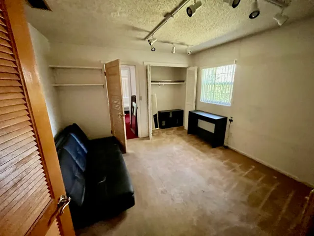 a view of livingroom with furniture and windows