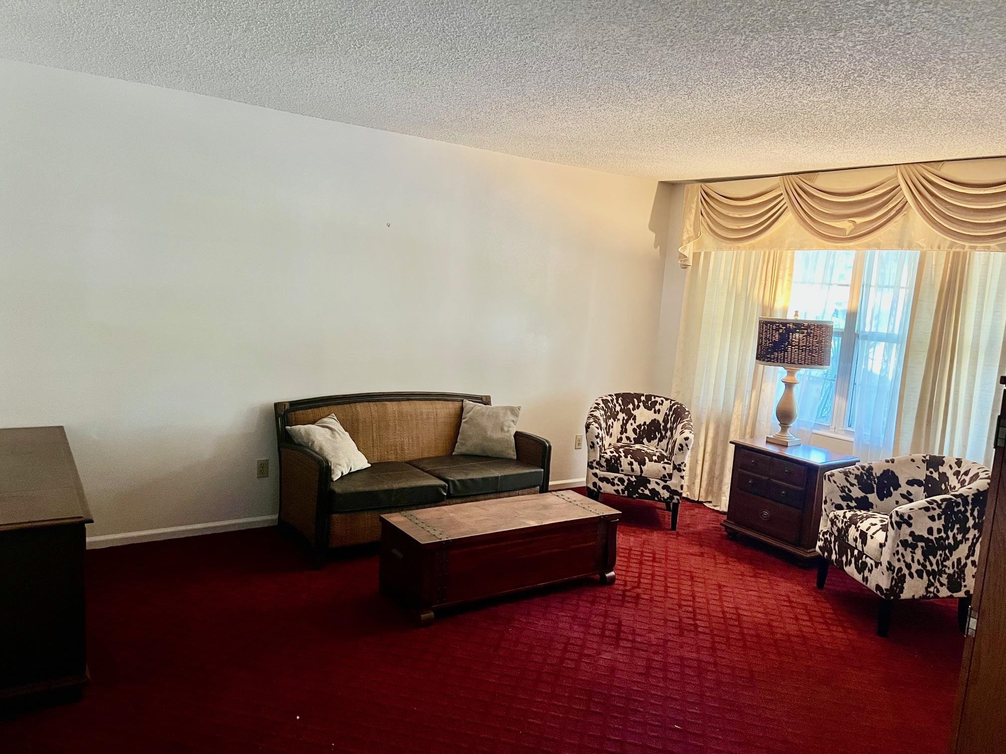 60 Palmer Street St. Augustine, FL 32084 - Photo 17 of 26 a bedroom with furniture and a window