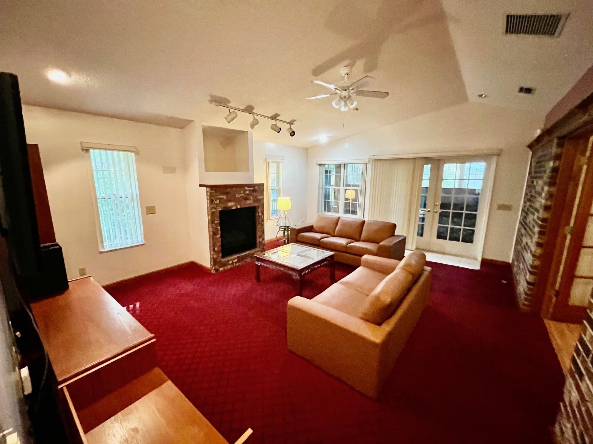 60 Palmer Street St. Augustine, FL 32084 - Photo 2 of 26 a living room with furniture fireplace and a flat screen tv