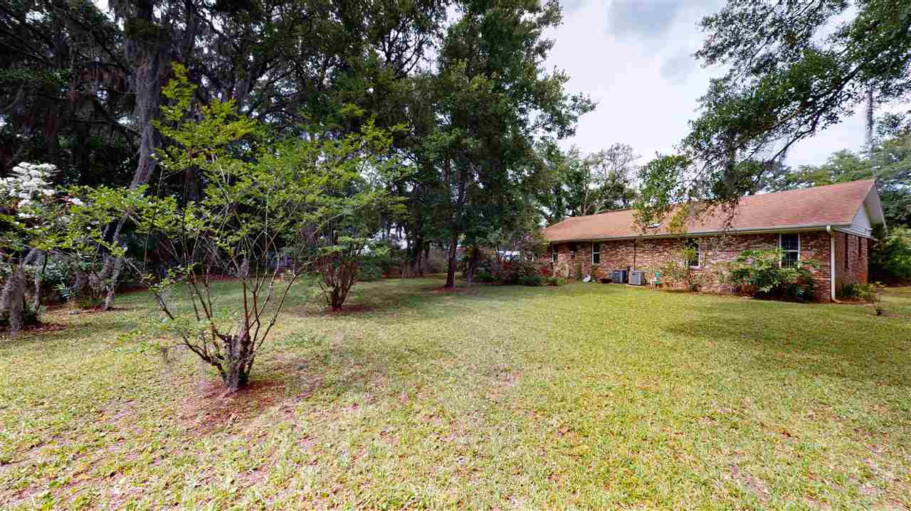 60 Palmer Street St. Augustine, FL 32084 - Photo 24 of 26 a view of a house with a yard and sitting area