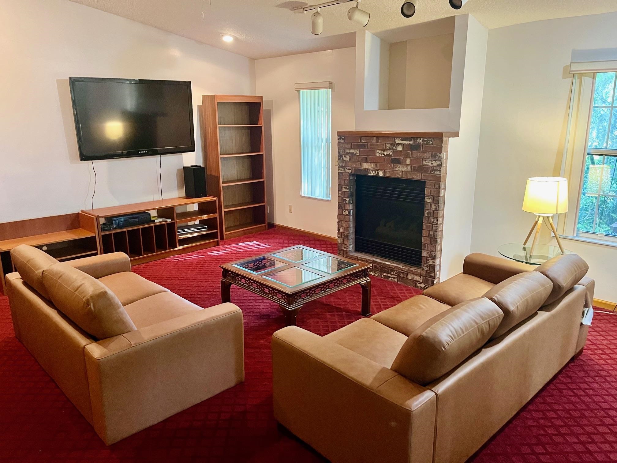 60 Palmer Street St. Augustine, FL 32084 - Photo 3 of 26 a living room with furniture and a flat screen tv