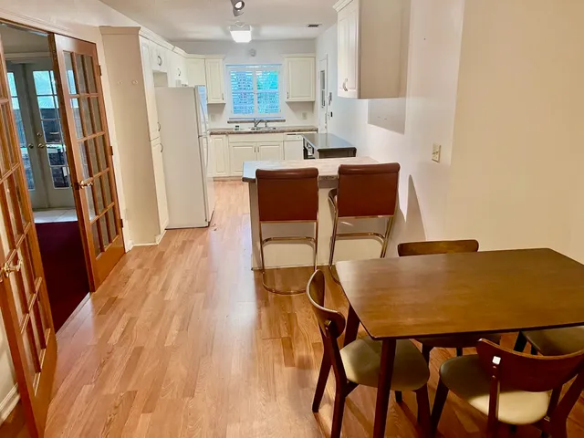 a view of a dining room with furniture and a table