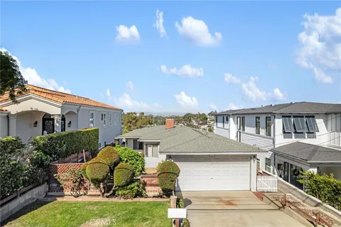 a aerial view of a house yard and a patio
