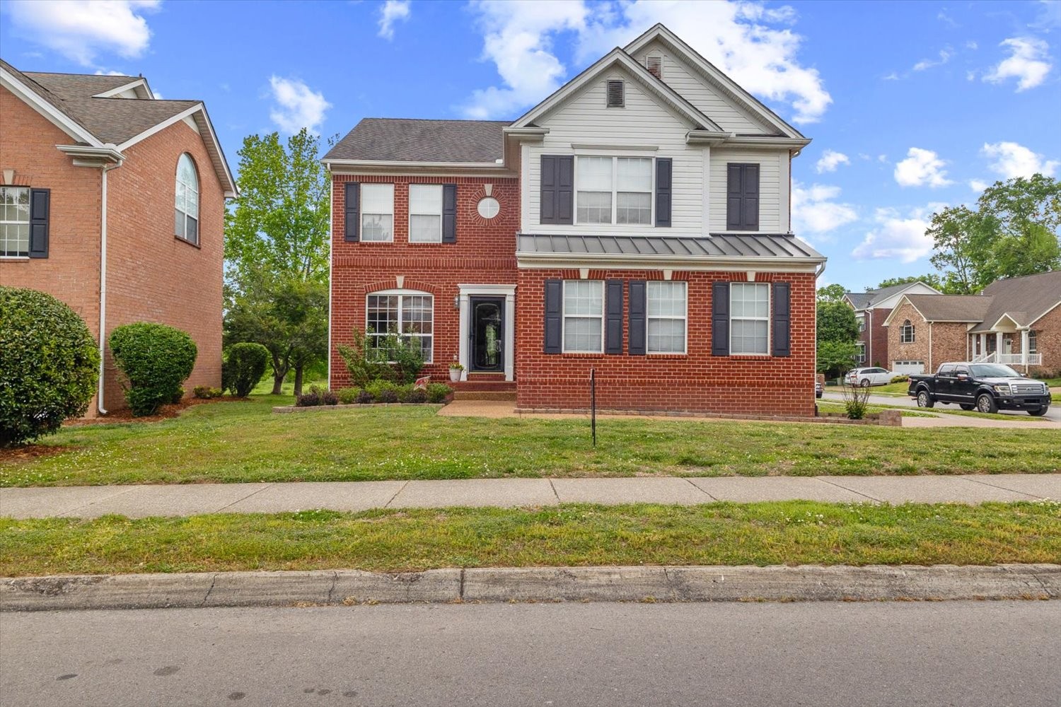 406 Orchid Road Franklin, TN 37064 - Photo 1 of 52 a front view of a house with a yard