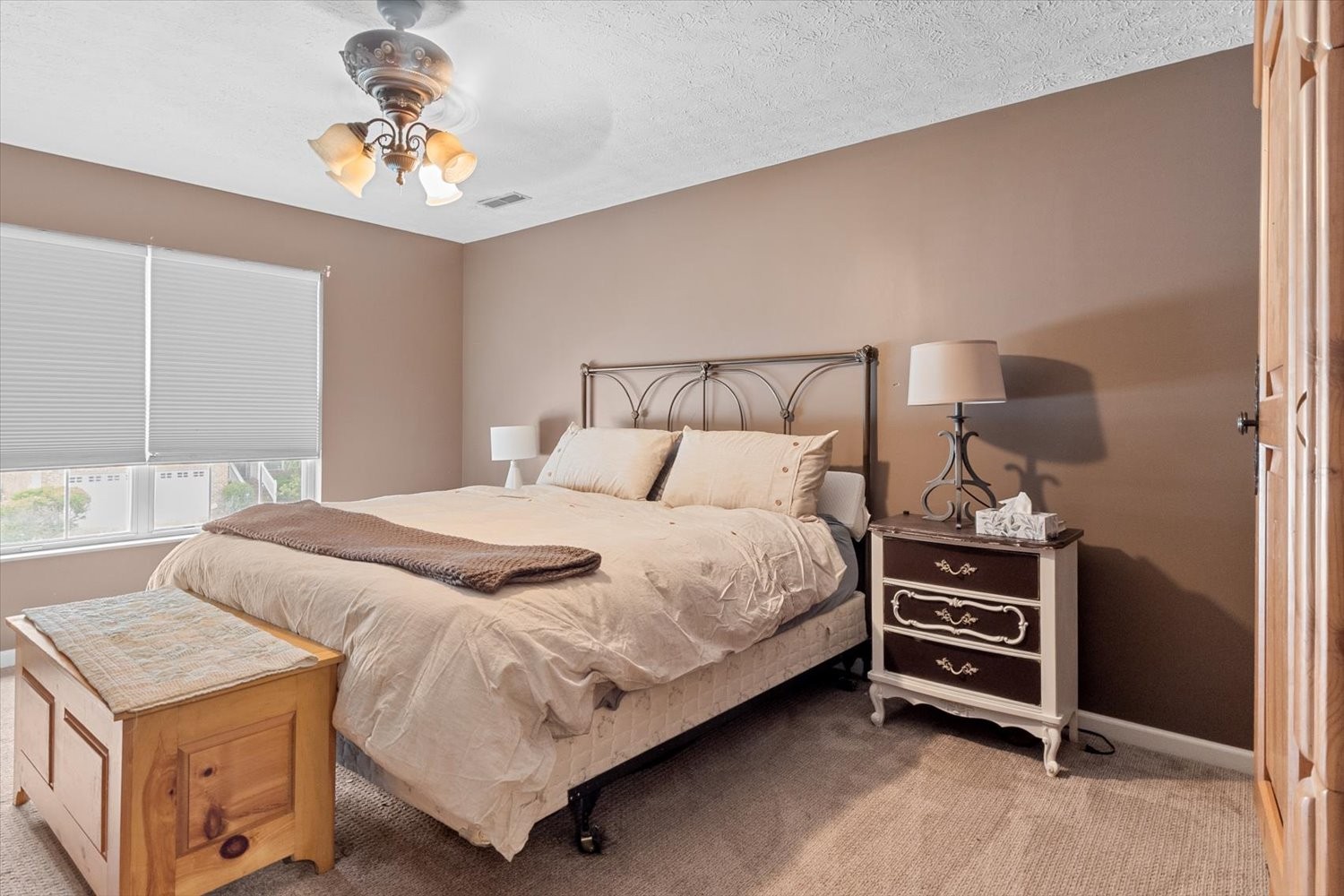 406 Orchid Road Franklin, TN 37064 - Photo 23 of 52 a bedroom with a bed and a chandelier