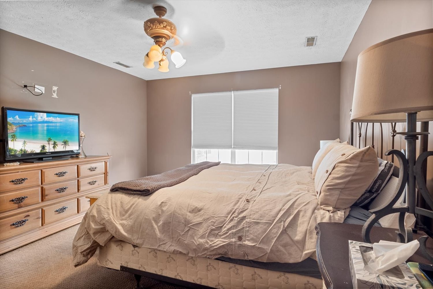406 Orchid Road Franklin, TN 37064 - Photo 24 of 52 a bedroom with a bed and a flat screen tv
