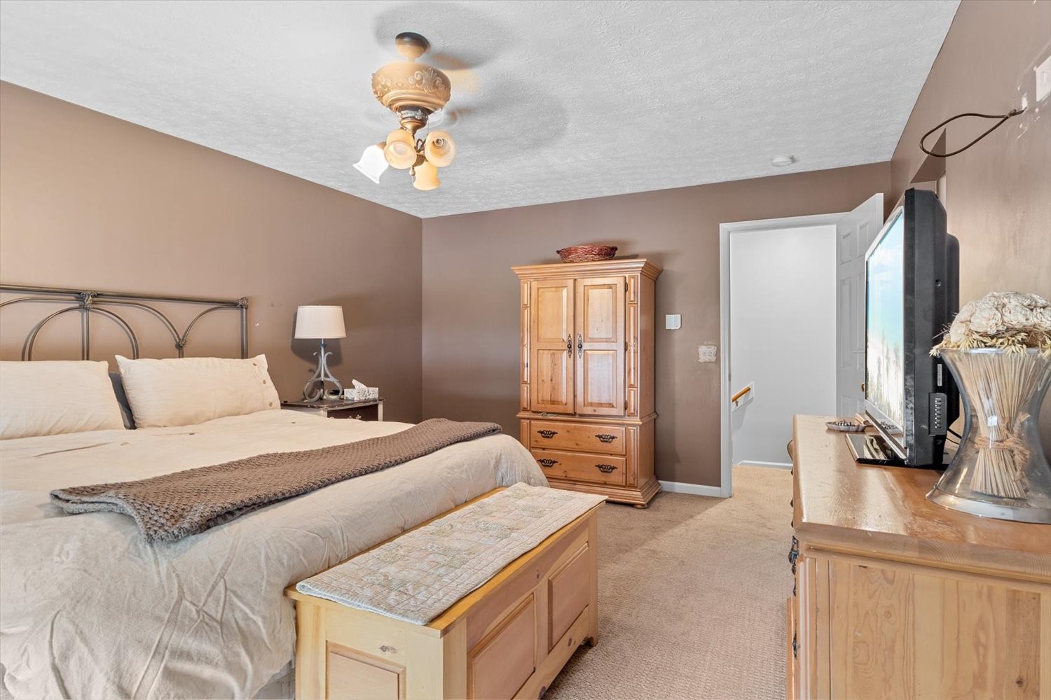 406 Orchid Road Franklin, TN 37064 - Photo 25 of 52 a bedroom with a bed and a chandelier