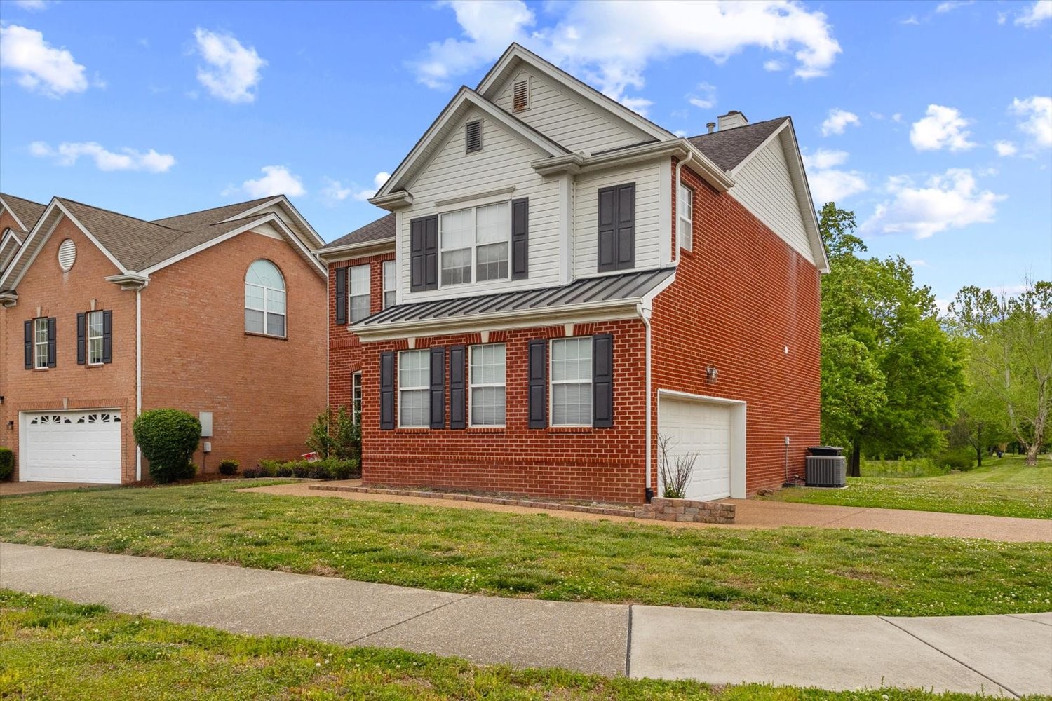 406 Orchid Road Franklin, TN 37064 - Photo 3 of 52 a front view of a house with a yard