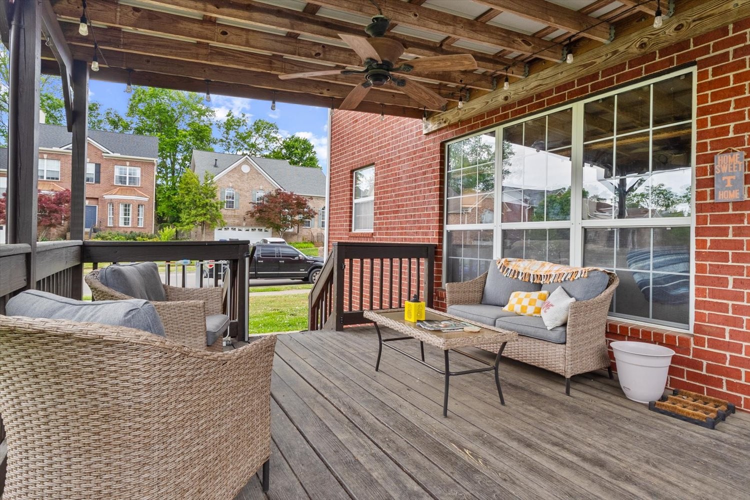 406 Orchid Road Franklin, TN 37064 - Photo 38 of 52 a view of a roof deck with table and chairs and wooden floor