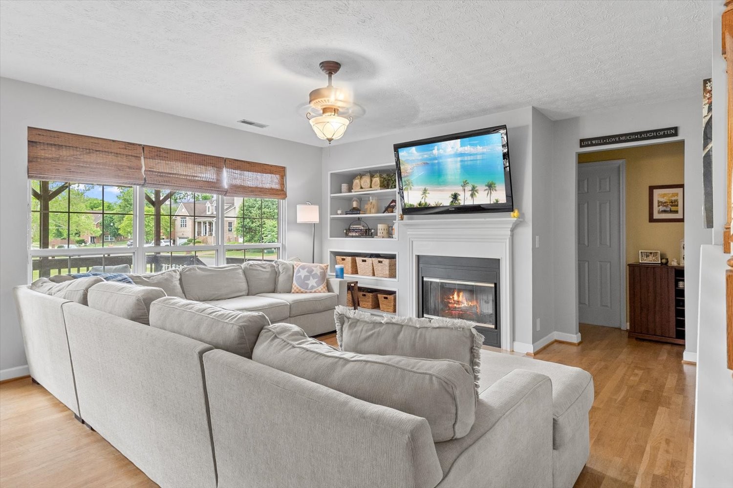 406 Orchid Road Franklin, TN 37064 - Photo 10 of 52 a living room with furniture a flat screen tv and a fireplace
