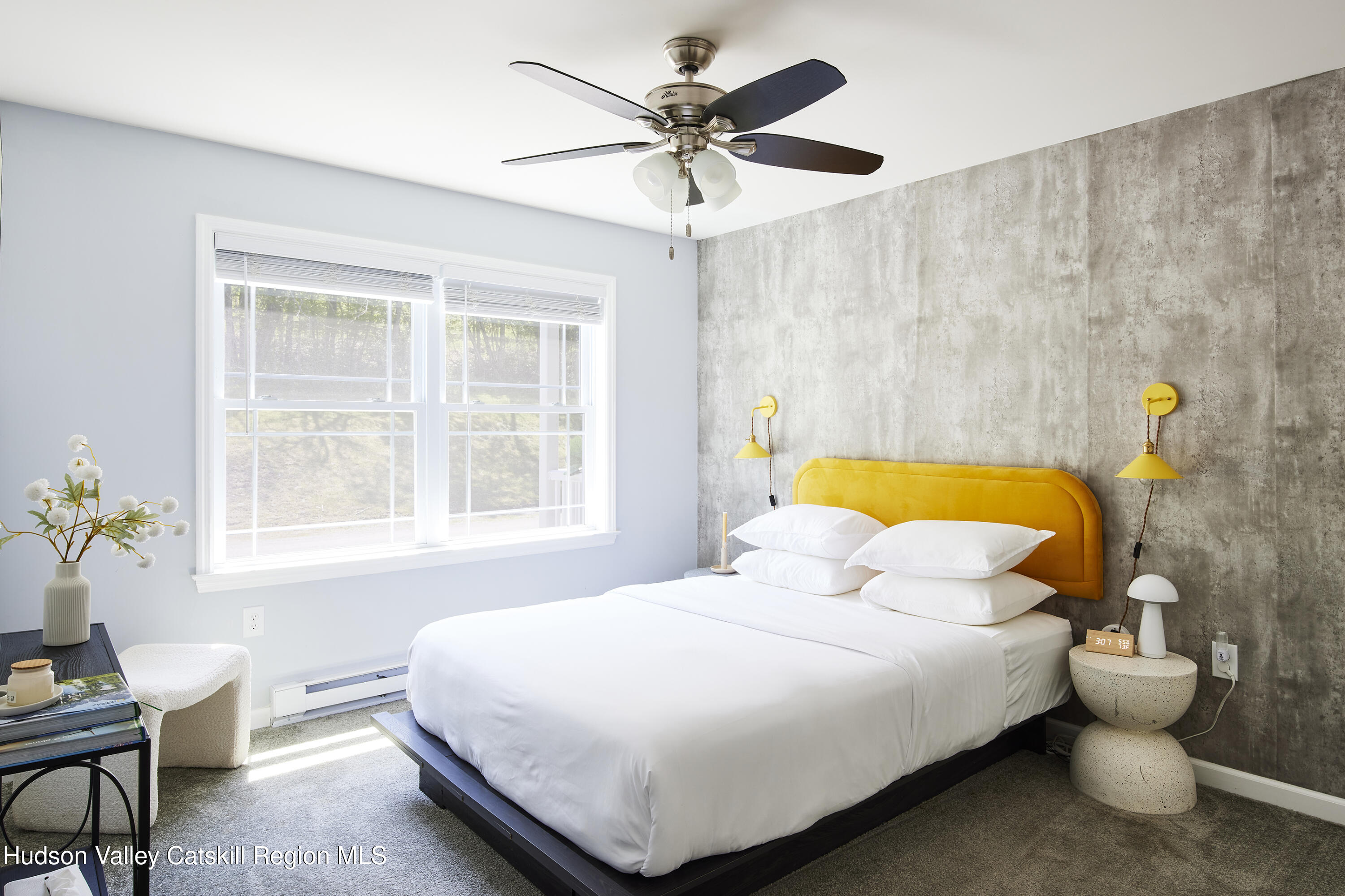 55 Hunter Road Parksville, NY 12768 - Photo 17 of 35 a bedroom with a bed and a chandelier
