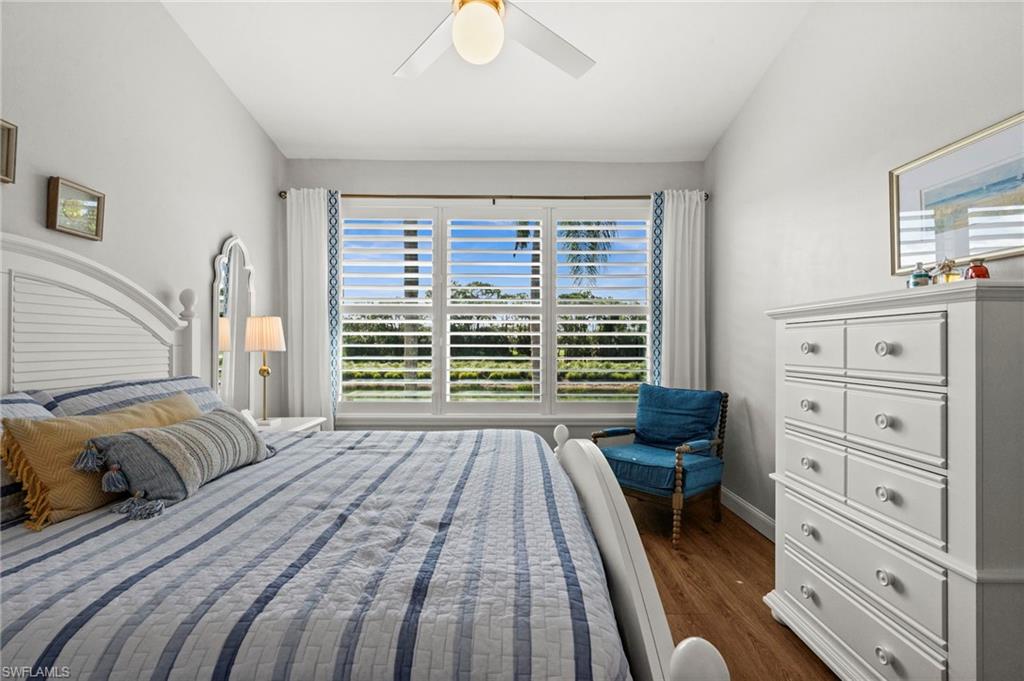 9331 Spring Run Boulevard, Unit 3005 Estero, FL 34135 - Photo 24 of 48 Wood-finish flooring with white baseboards