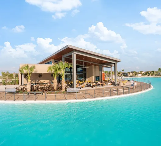a view of a swimming pool with an ocean view