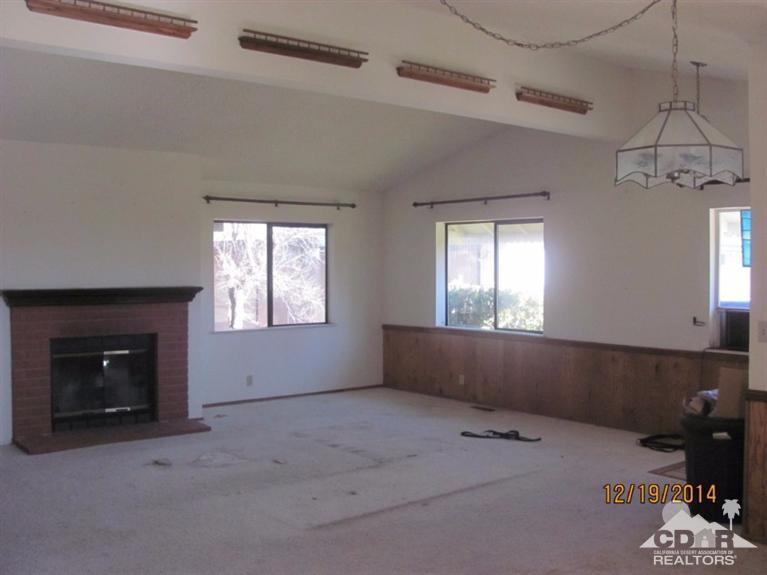 38498 Bahrman Road Anza, CA 92539 - Photo 3 of 8 a living room with a fireplace and a window