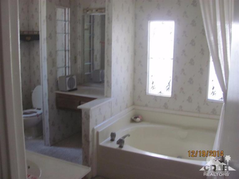 38498 Bahrman Road Anza, CA 92539 - Photo 4 of 8 a bath tub sitting next to a sink
