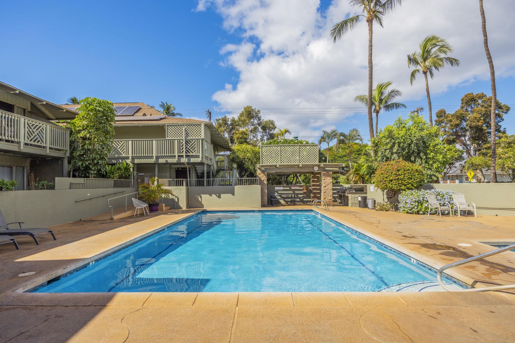 715 South Kihei Road, Unit 107 Kihei, HI 96753 - Photo 18 of 29 a view of a swimming pool with an outdoor seating