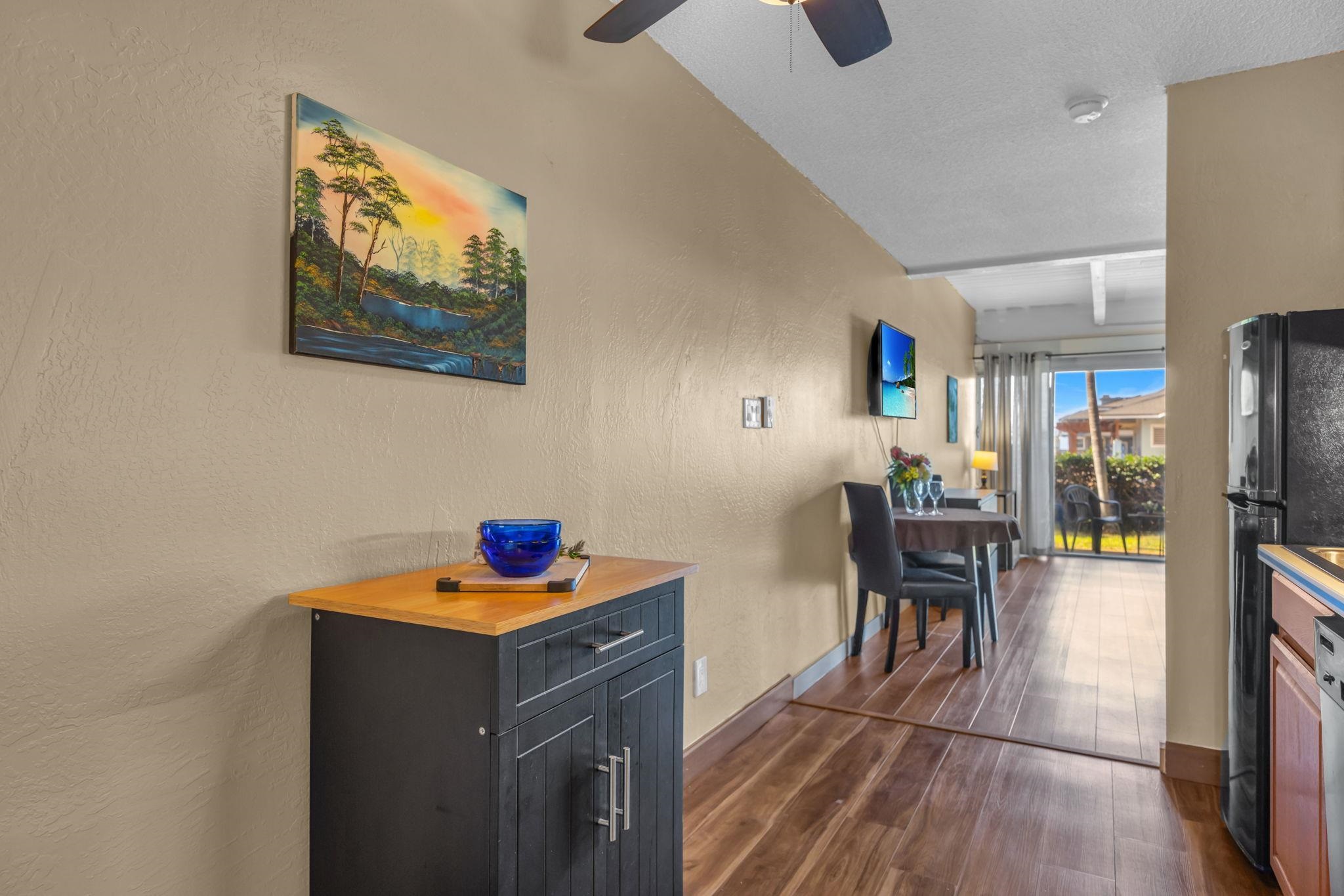 715 South Kihei Road, Unit 107 Kihei, HI 96753 - Photo 5 of 29 a dining room with furniture and wooden floor