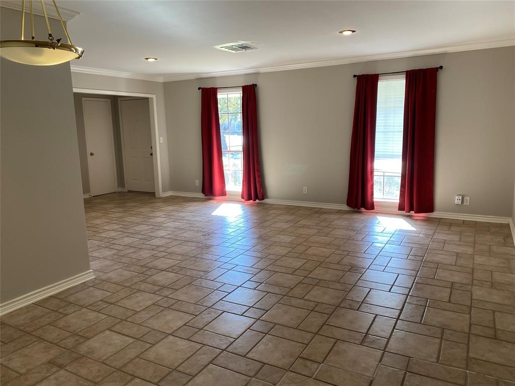 4402 Cheena Drive Houston, TX 77096 - Photo 8 of 35 a view of an empty room with window and chandelier