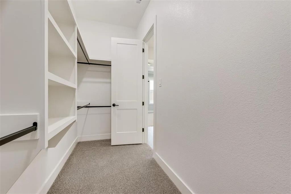 1327 Selby Road Van Alstyne, TX 75495 - Photo 23 of 32 Walk in closet featuring light carpet