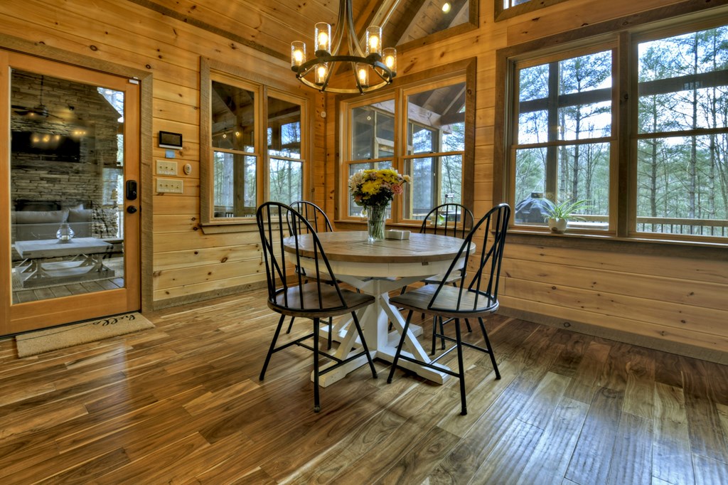 705 George Curtis Road Blue Ridge, GA 30513 - Photo 17 of 49 a view of a dining room with furniture window and wooden floor